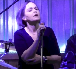 Liz sings "Someday Soon."